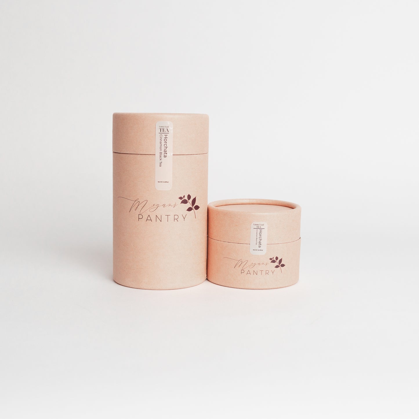 Two cylindrical containers with 'Megan's Pantry' branding on a white background