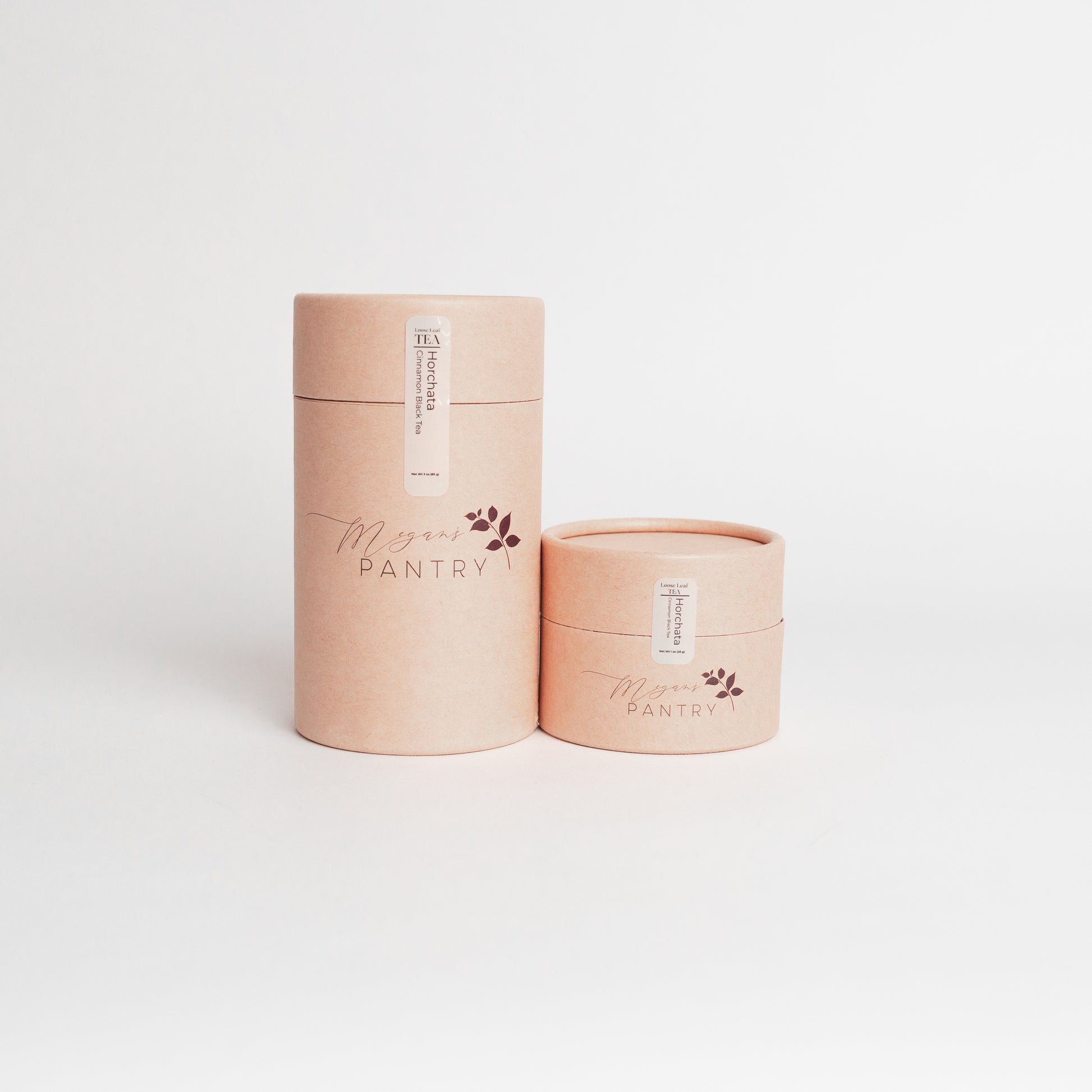 Two cylindrical containers with 'Megan's Pantry' branding on a white background