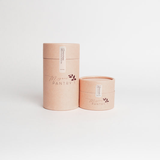 Two cylindrical containers with 'Megan's Pantry' branding on a white background