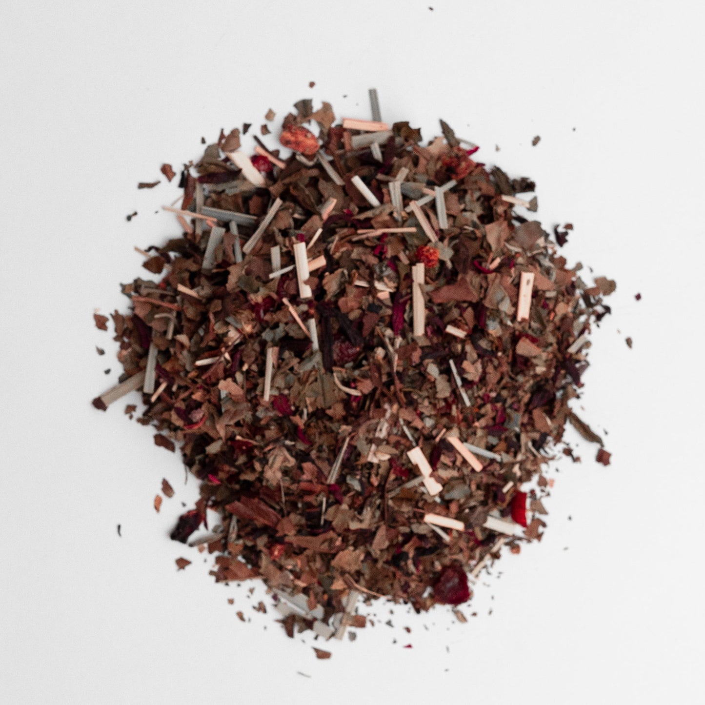 Mixture of dried herbs and spices on a white background