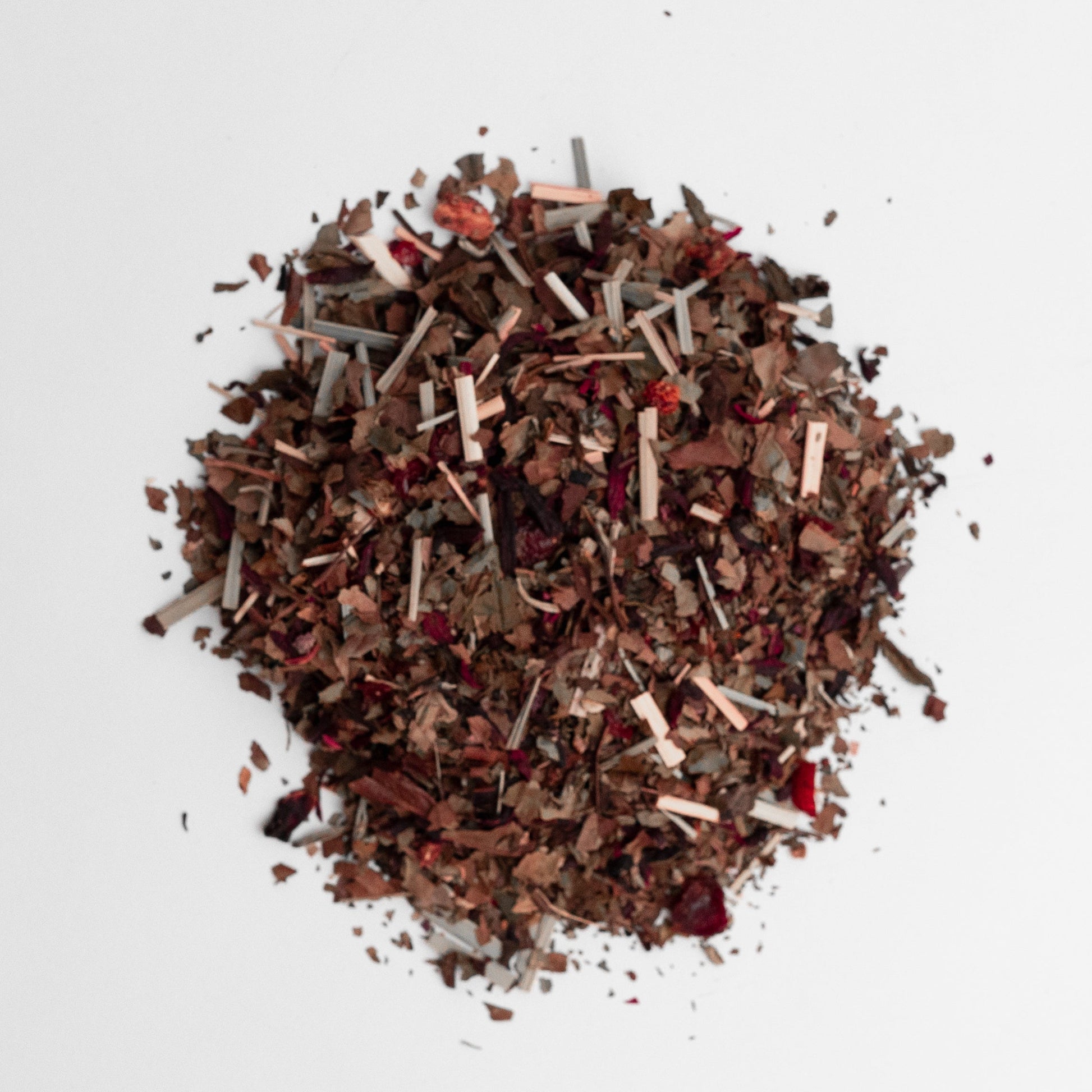 Mixture of dried herbs and spices on a white background