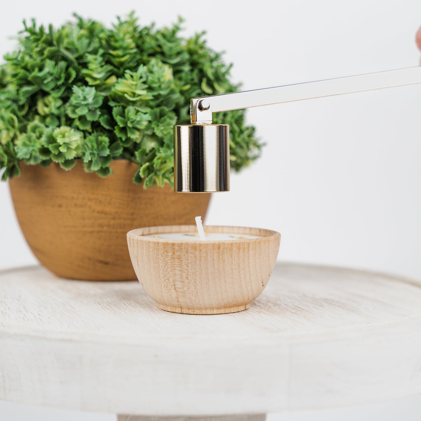 Set of four essential oil soy tealight candles from Megan’s Pantry in reusable wooden bowls, adorned with botanicals—natural, eco-friendly aromatherapy gift set.