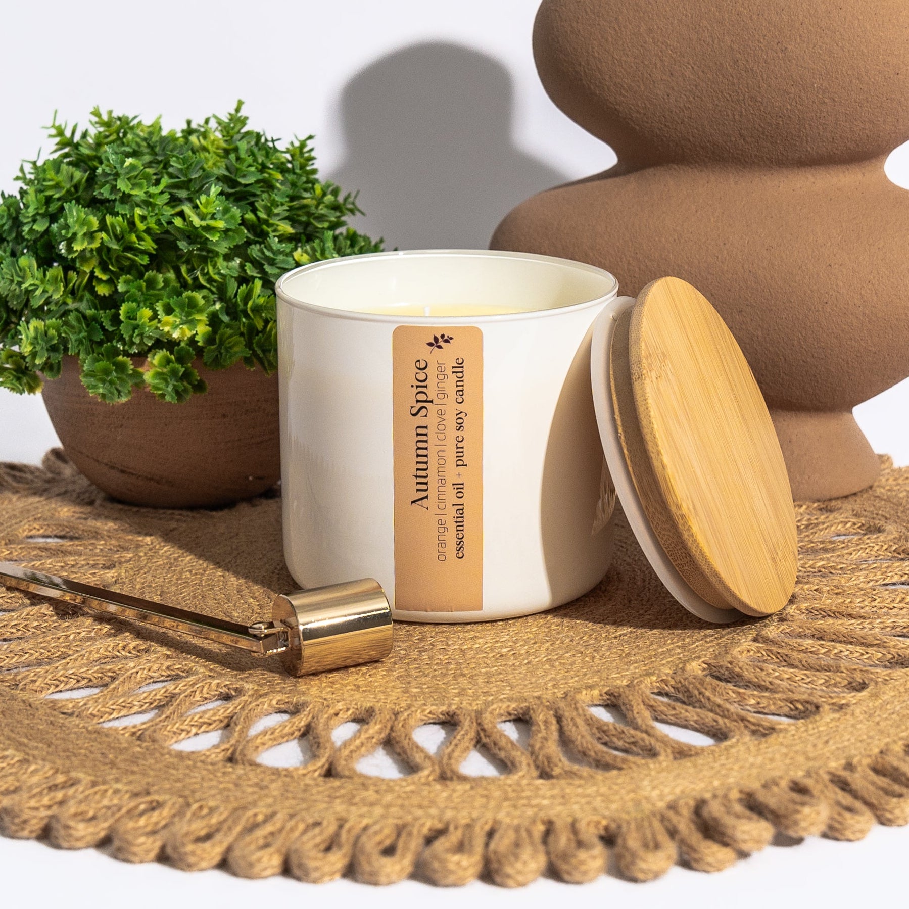 Autumn Spice is a blend of orange, cinnamon, clove and ginger essential oils, creating the perfect, warm Autumn aroma. Each 16-ounce candle is presented in a stunning glass jar with a bamboo lid, making it a timeless piece for your home or a thoughtful gift for anyone who cherishes moments of calm.